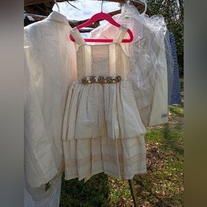 Elegant Cream Dress with Embellished Waist